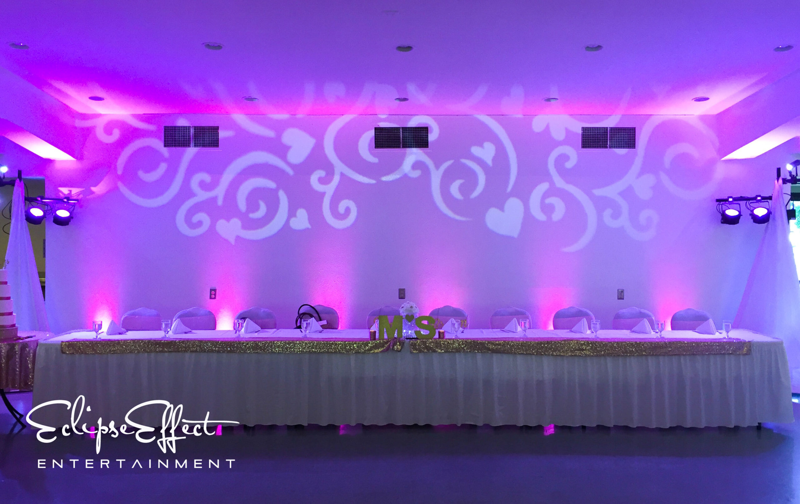 Head table uplighting with a monogram design.